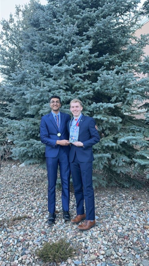 Shah and Runtsch posing with their award after a hard fought matchup at state.