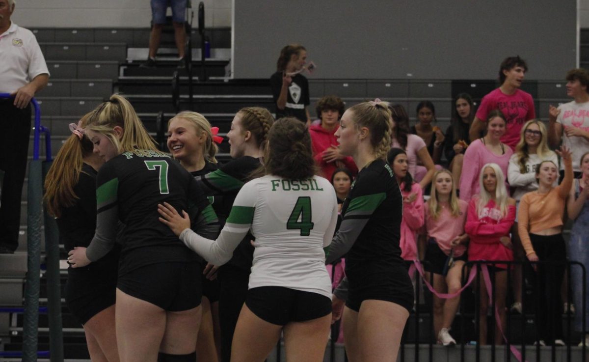 Sabercats celebrate after a kill made by Erin Herrmann.