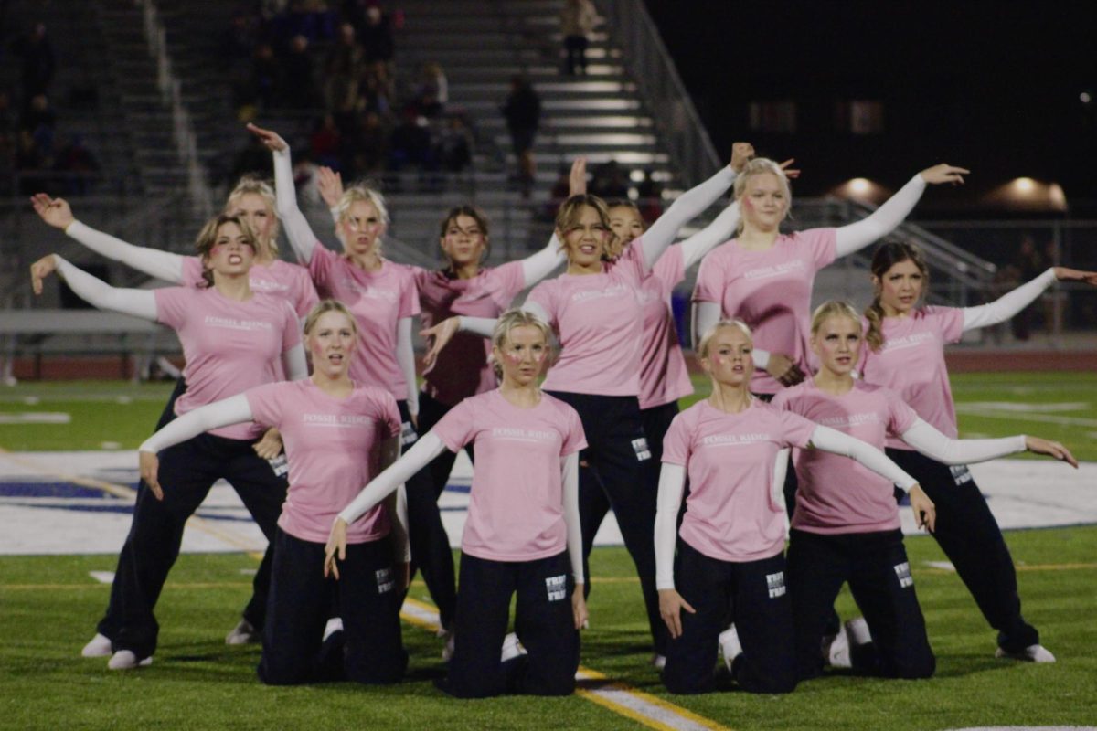 Fossil Ridge Dance Team performing during halftime football game against Fairview.