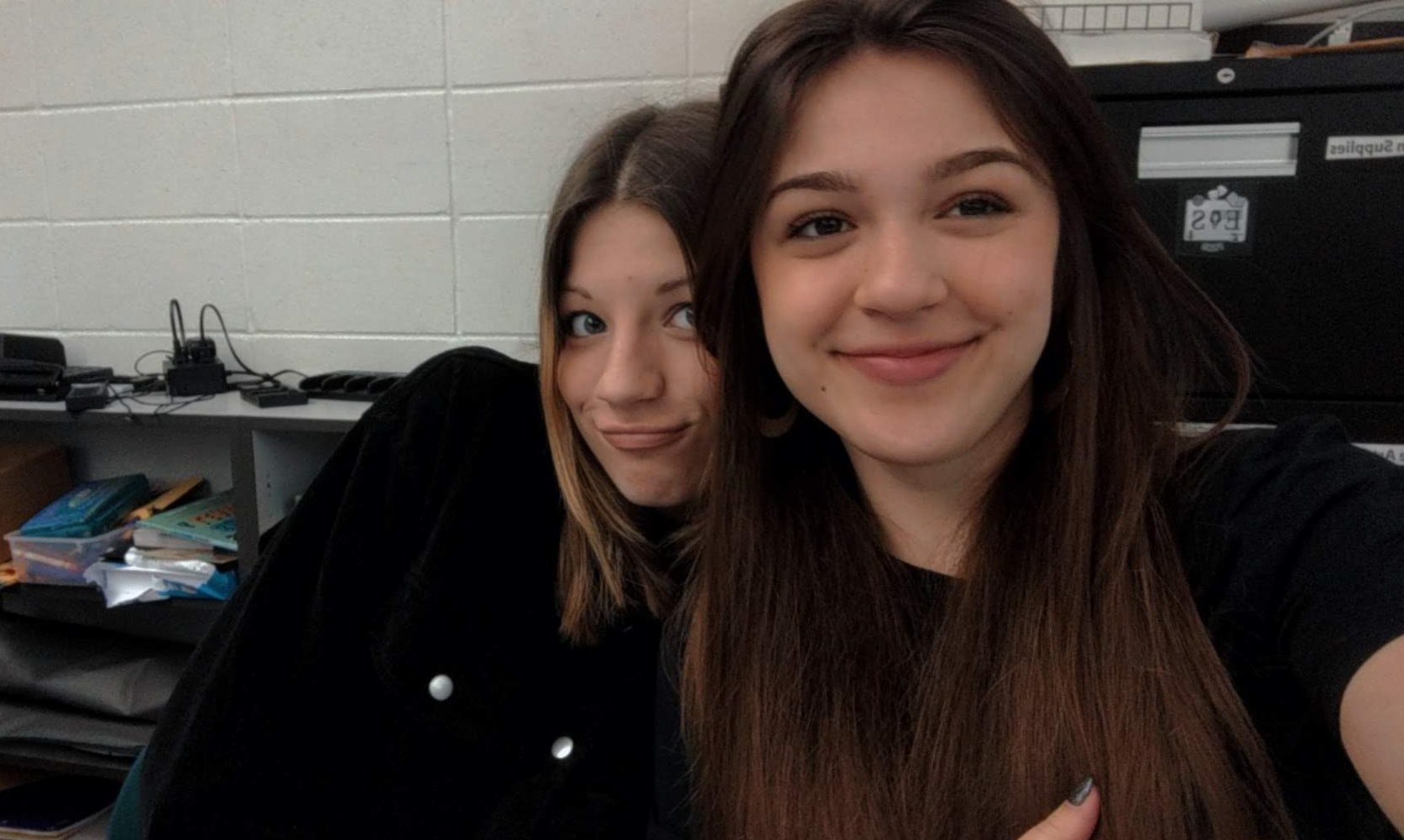 Aislyn and Sophie in the journalism classroom.
