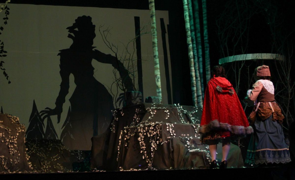 Cinderella (Aderyn Ketchum) and Little Red Riding Hood (Karoline Maloy) watch as the giant is slain.