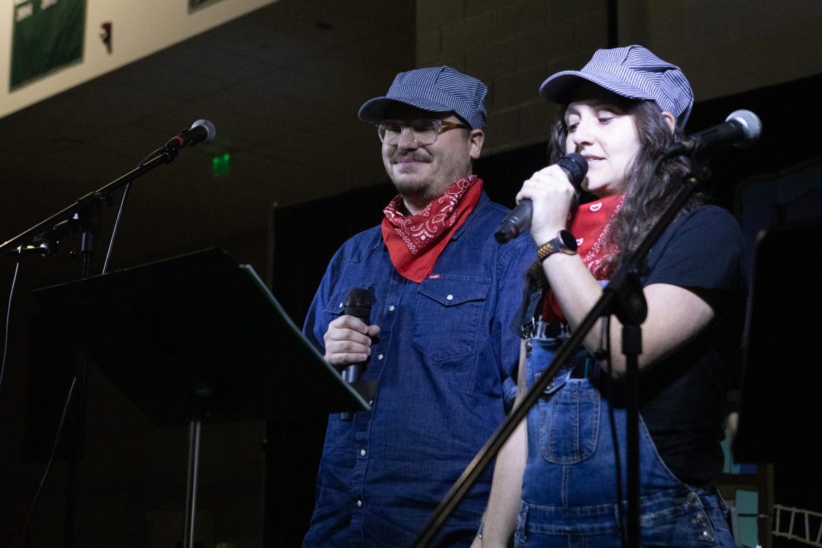 Alex Oberto and Remy Gargulio dress up in train conductor gear to host the 2024 People’s Choice Awards.