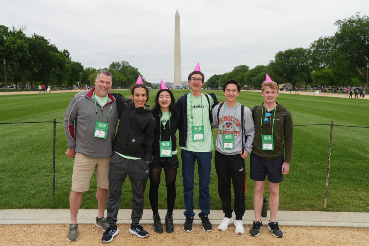 The Science Bowl team in Washington D.C. standing by the monument 
