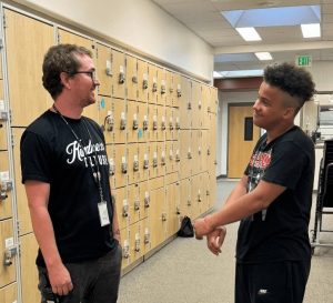 Campus Monitor Ian Bell chats with sophomore Jordan Howard. 