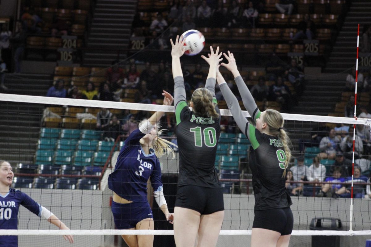 The Ewing sisters block a Valor spike in last years Championship match.