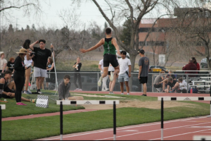 Marcus Mozer does long jumps at a track meet in April 2024.