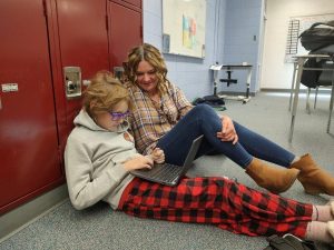 Jill Cottingham working with 6th grader Finn Maycumber at Blevins Middle School.