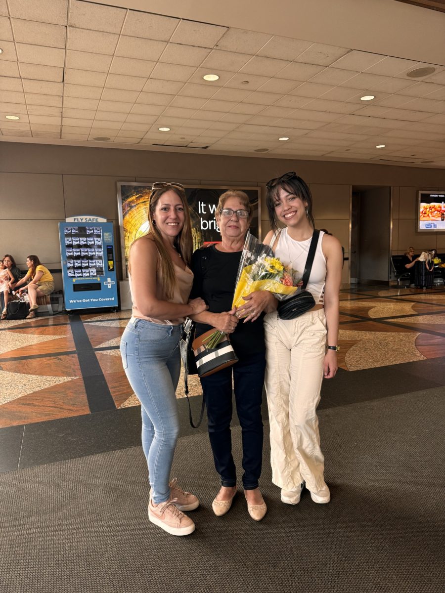 Zamira Hernandez with her grandmother at the airport, her grandma’s first time in the U.S.