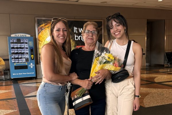 Zamira Hernandez with her grandmother at the airport, her grandma’s first time in the U.S.