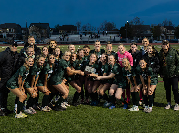 Fossil Ridge girls soccer team celebrates a win on senior night and holds up the city league trophy on April 29 at home.