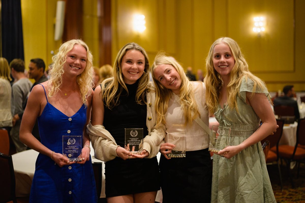 After all being inducted into Colorado's Running Hall of Fame, Tatum Berg(left) stands with Rosie Mucharsky, Ella Hagen, and Tessa Walter.