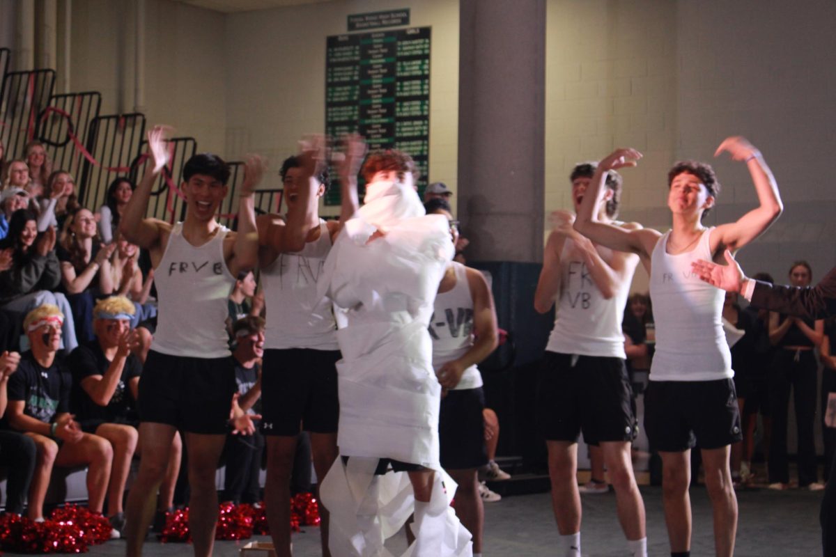 Fossil Ridge Boys Volleyball team wraps Jason Mynatt