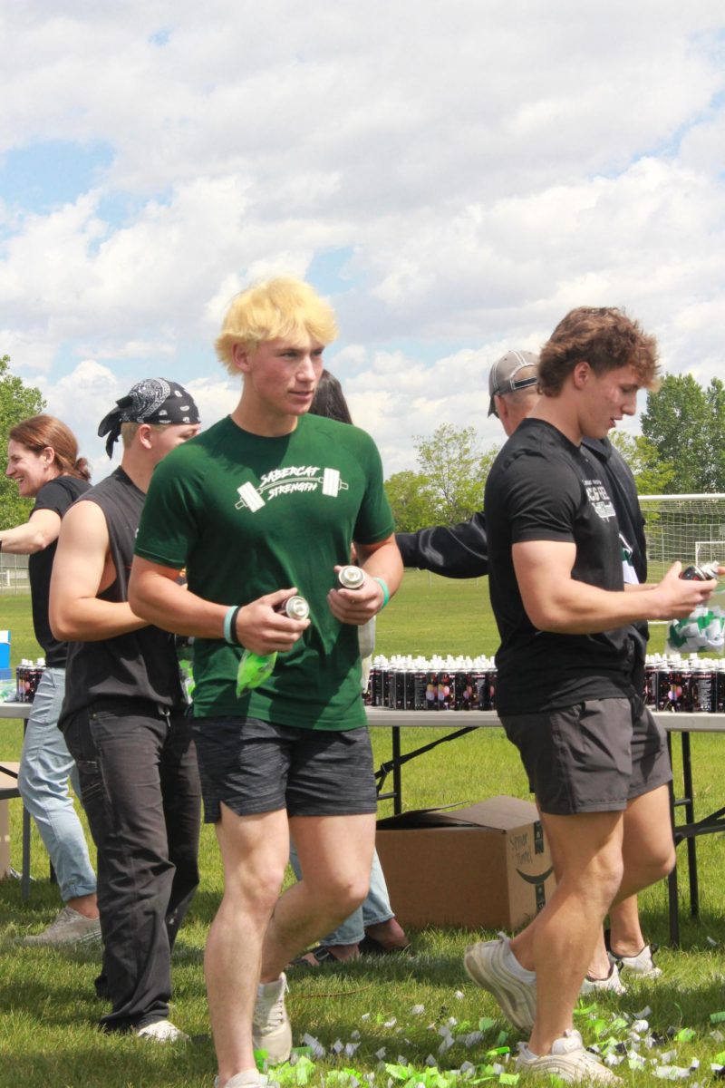 Owen Morgan gets silly string cans to spray underclassmen.