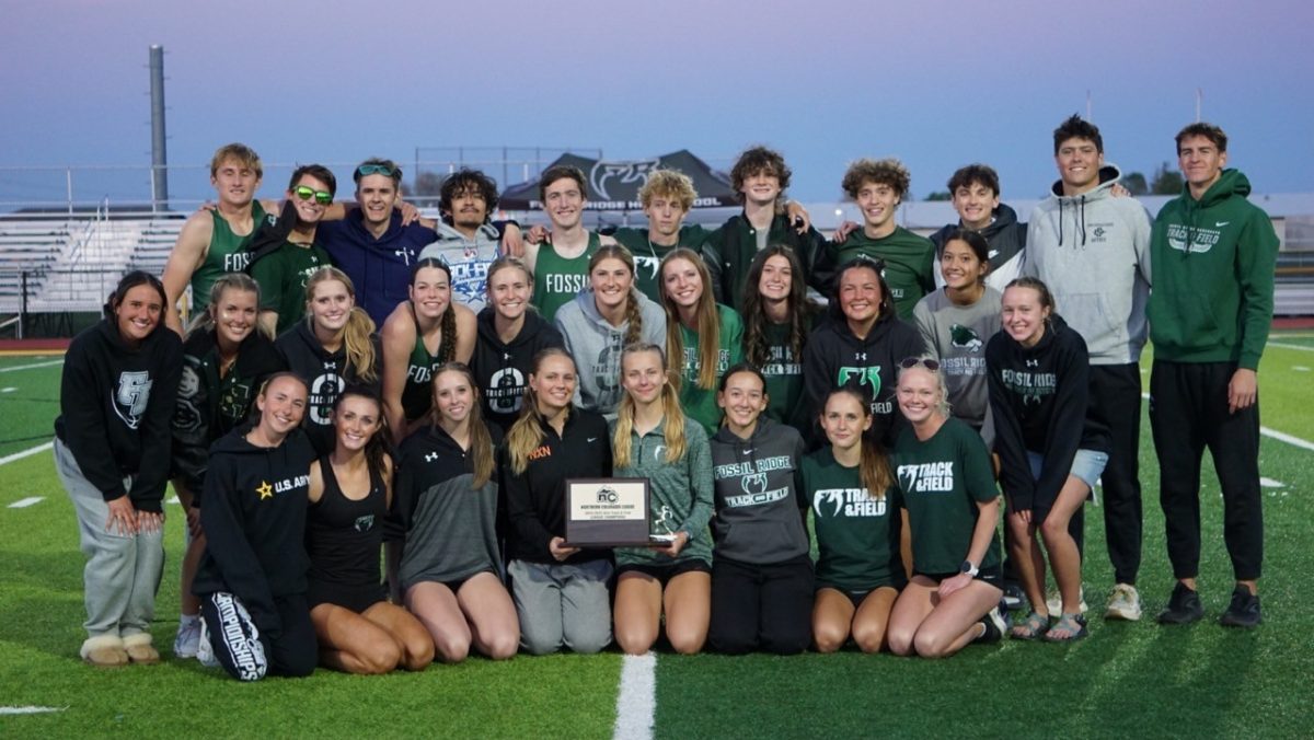 Conference athletes pose with the girls award for first place. (Dani Cook)