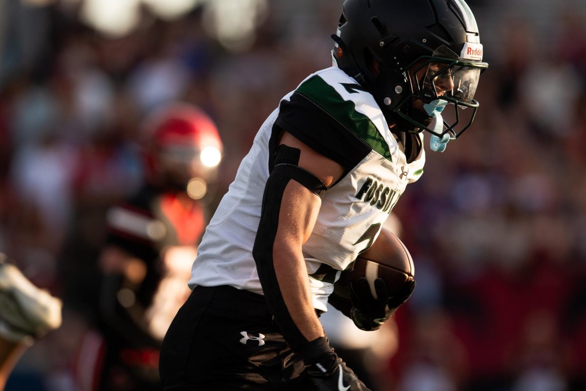 Fossil Ridge's Will Hough (2) takes the ball in for a touchdown during the season-opening game against Loveland on Aug. 28, 2025 at Ray Patterson Field in Loveland, Colo.