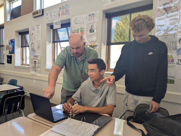 Turpin (left) and Darien Bjorneboe (right) help Oscar Cytrynowicz.
