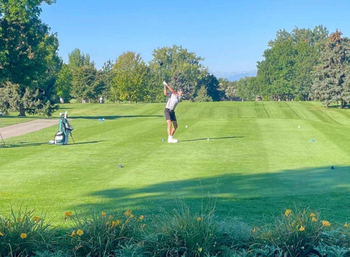 Freshman Judd Nikkel tees off at hole 1 at Highland Hills Golf Course in Greeley on Sept. 15.
