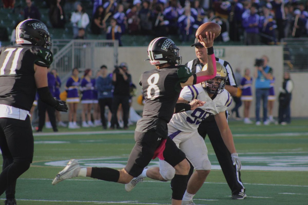 Quarterback and junior Nick Kubat throws to teammate(2023).