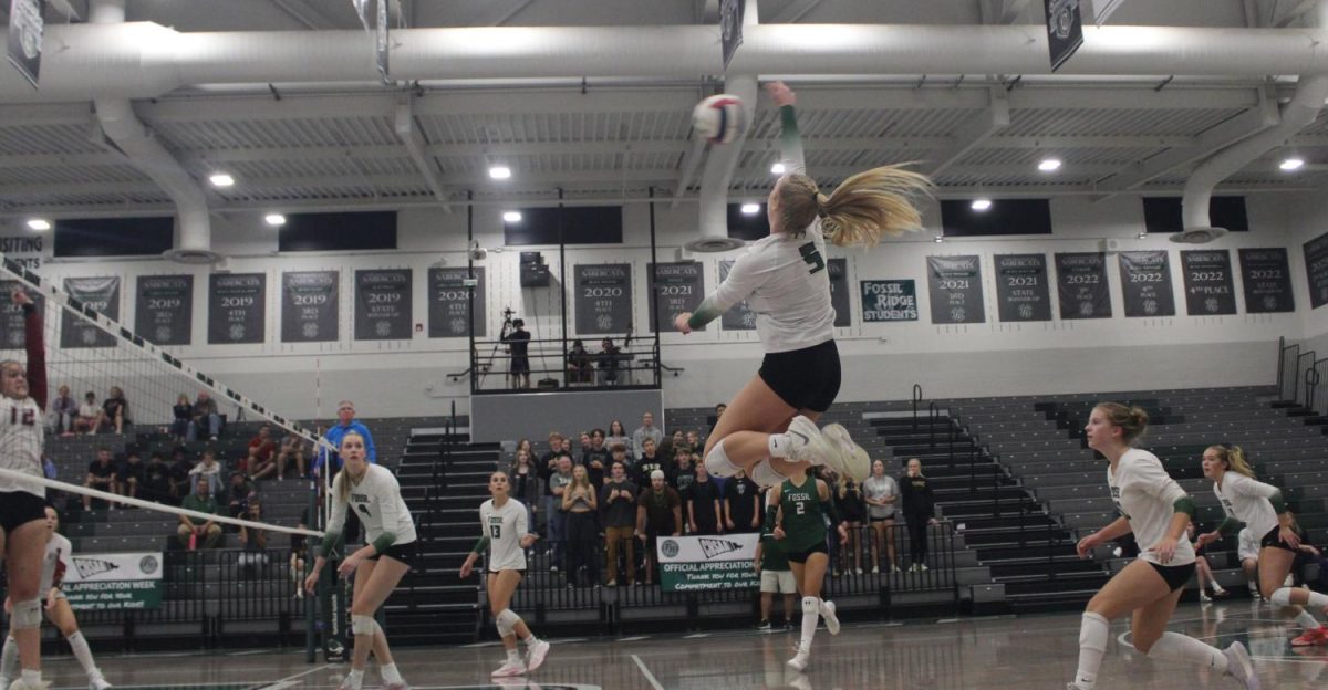 Captain Emery Johnson captured in the air during a game against Rocky Mountain High School on Tuesday Oct. 7.
