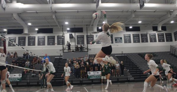 Captain Emery Johnson captured in the air during a game against Rocky Mountain High School on Tuesday Oct. 7.
