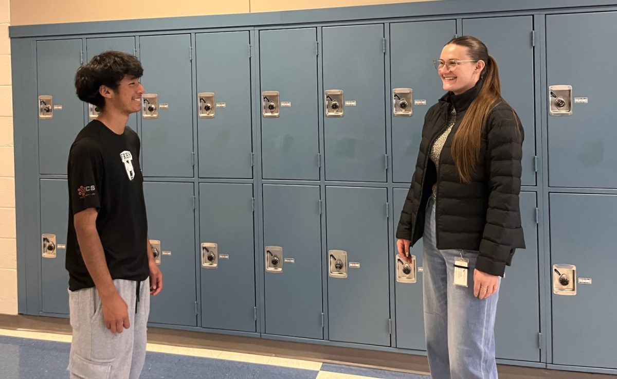 Hall Monitor Destiny Smith talks with freshman Estiben (Steven) Flores Arevalo.
