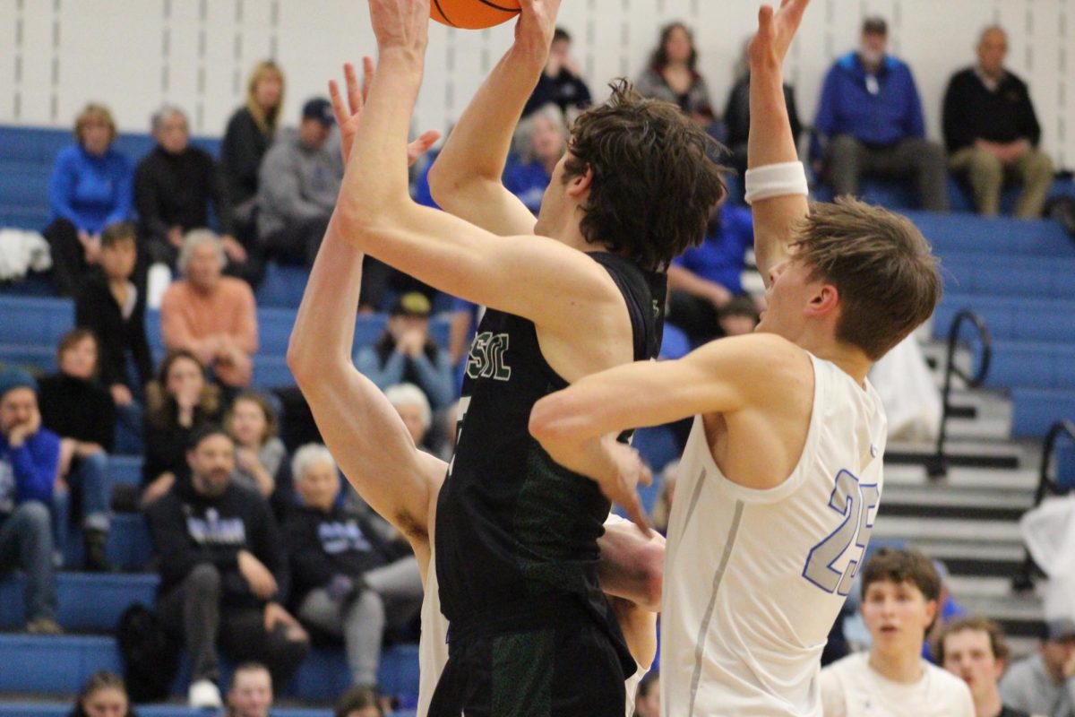 Eli Hughes fights through tough defense at the rim against Poudre on January 23, 2026 at Poudre high school.