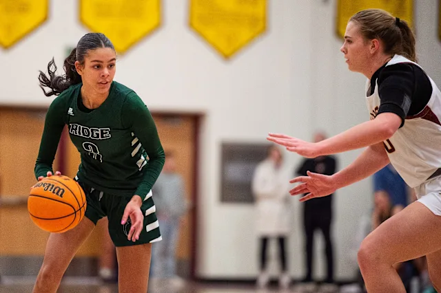 Fossil Ridge's Lauren Smith tries to get around defenders during a city rivalry high school basketball game against Rocky Mountain on Tuesday, Jan. 28, 2025 at Rocky Mountain High School in Fort Collins, Colo. Courtesy of Yahoo Sports