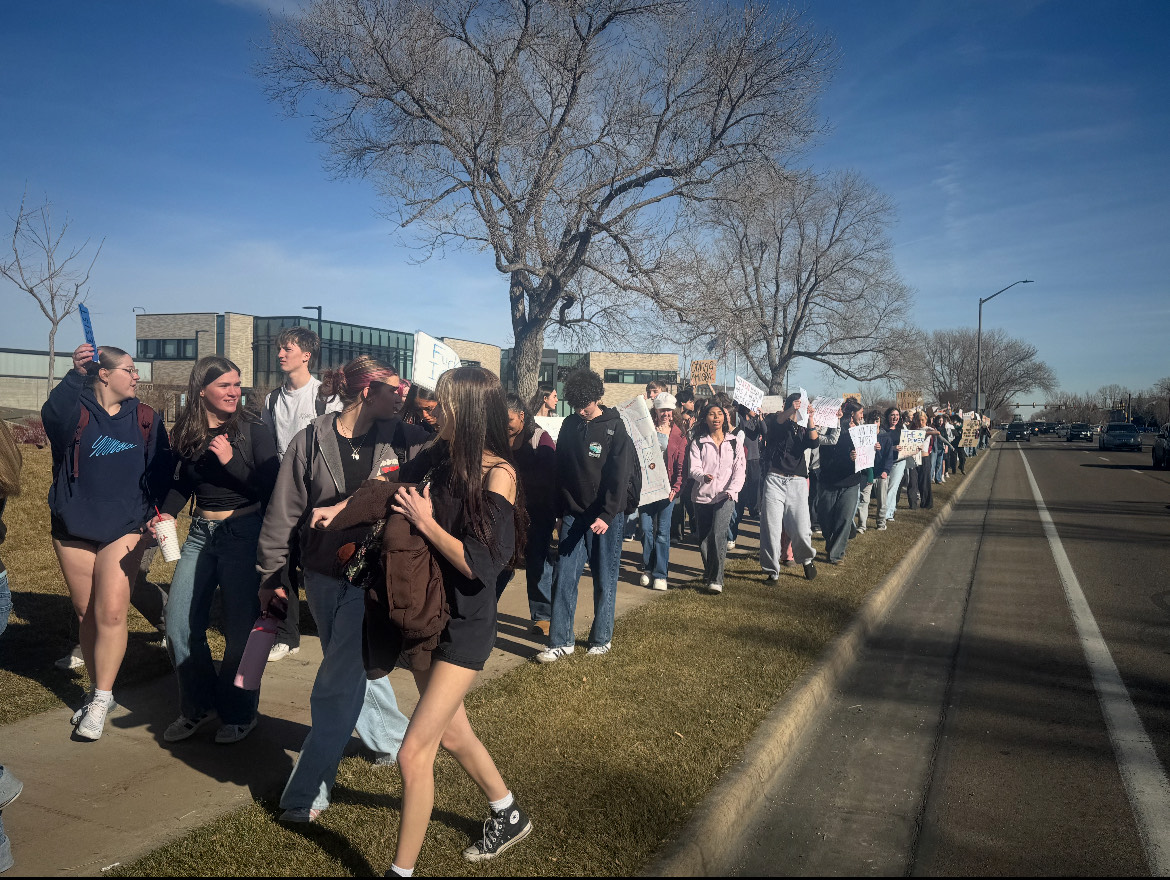 Students from Fort Collins High School walk to protest ICE.  