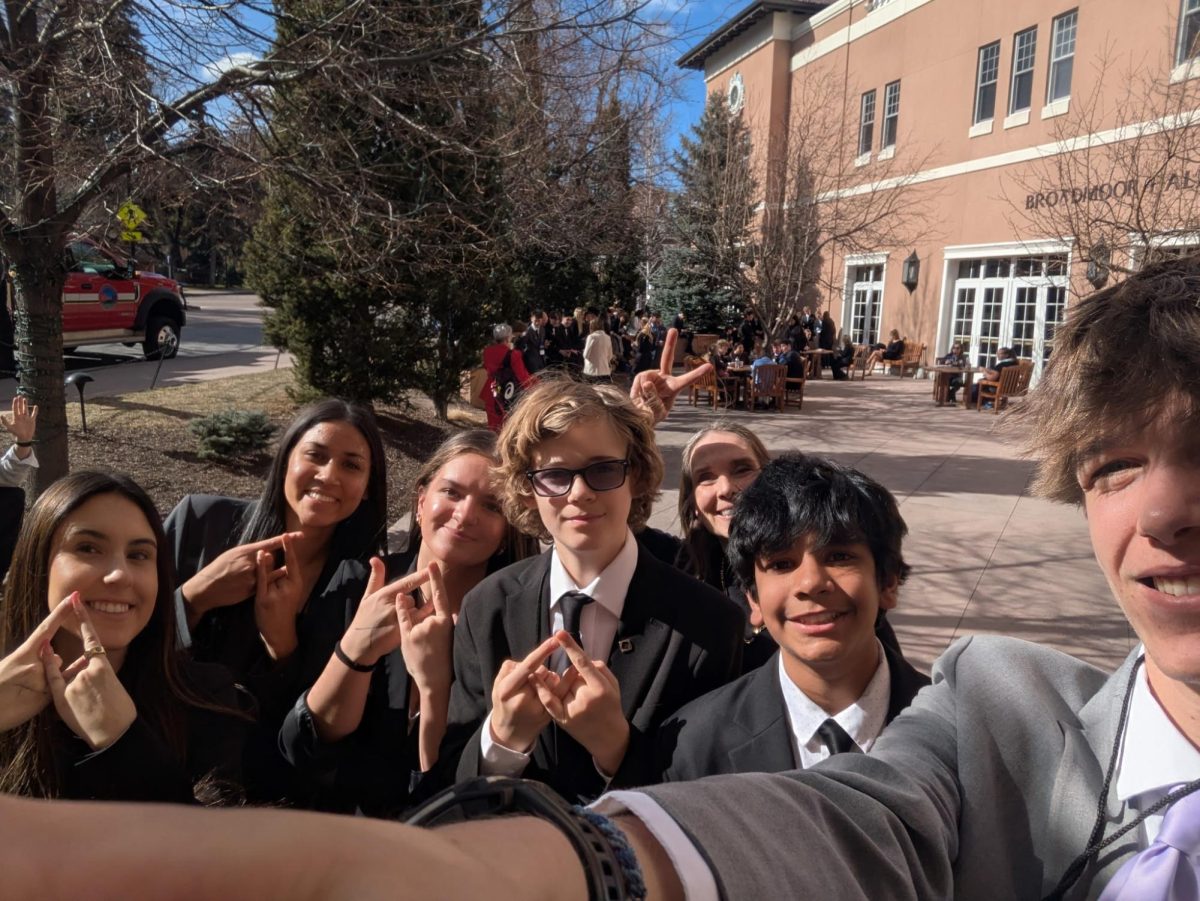 Fossil Ridge state DECA competaros take selfie holding up a DECA hand sign in Colorado Springs at the Broadmoor on February 22, 2026.