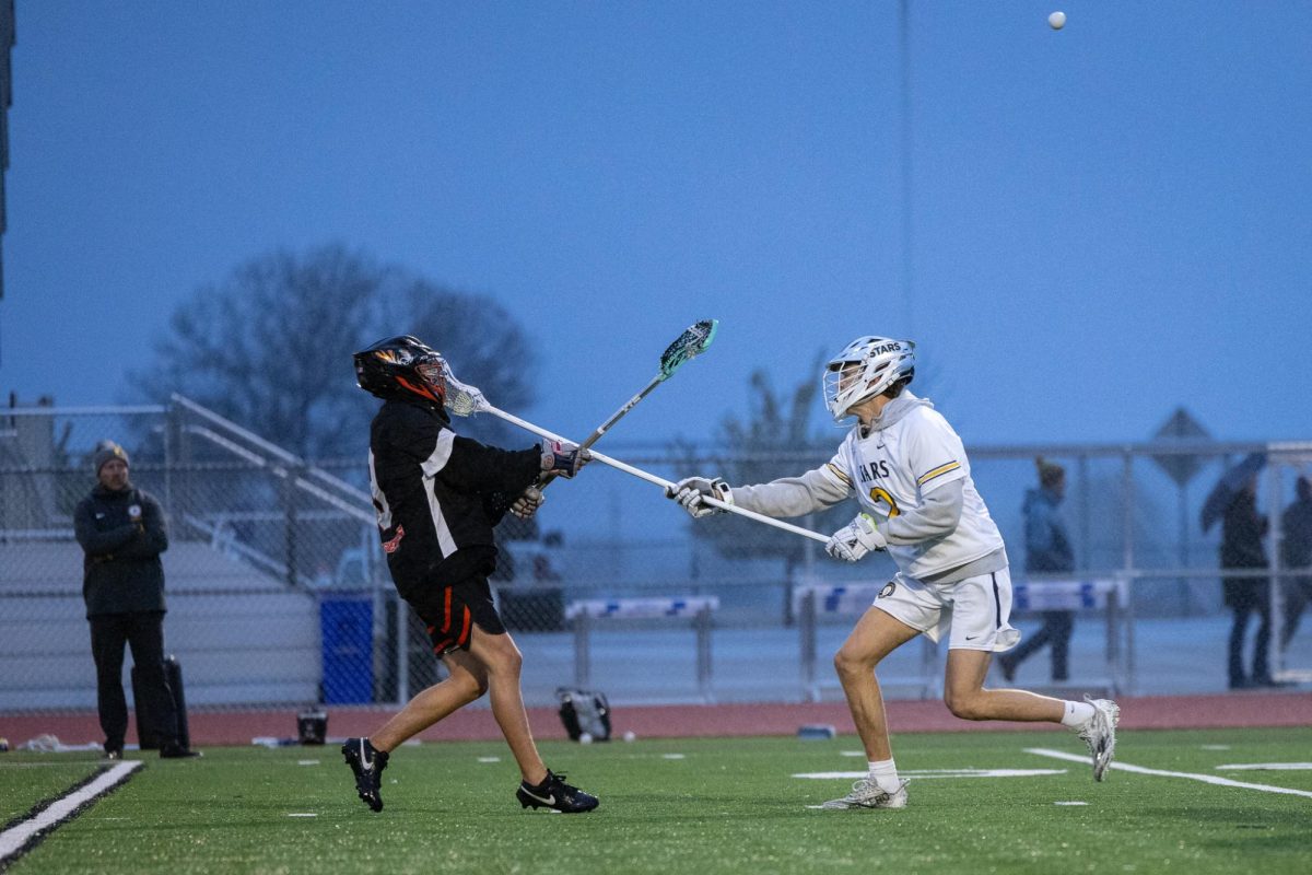 Drew Seufer, #2, plays aggressive defense during PSD Stars game in 24-25 season.