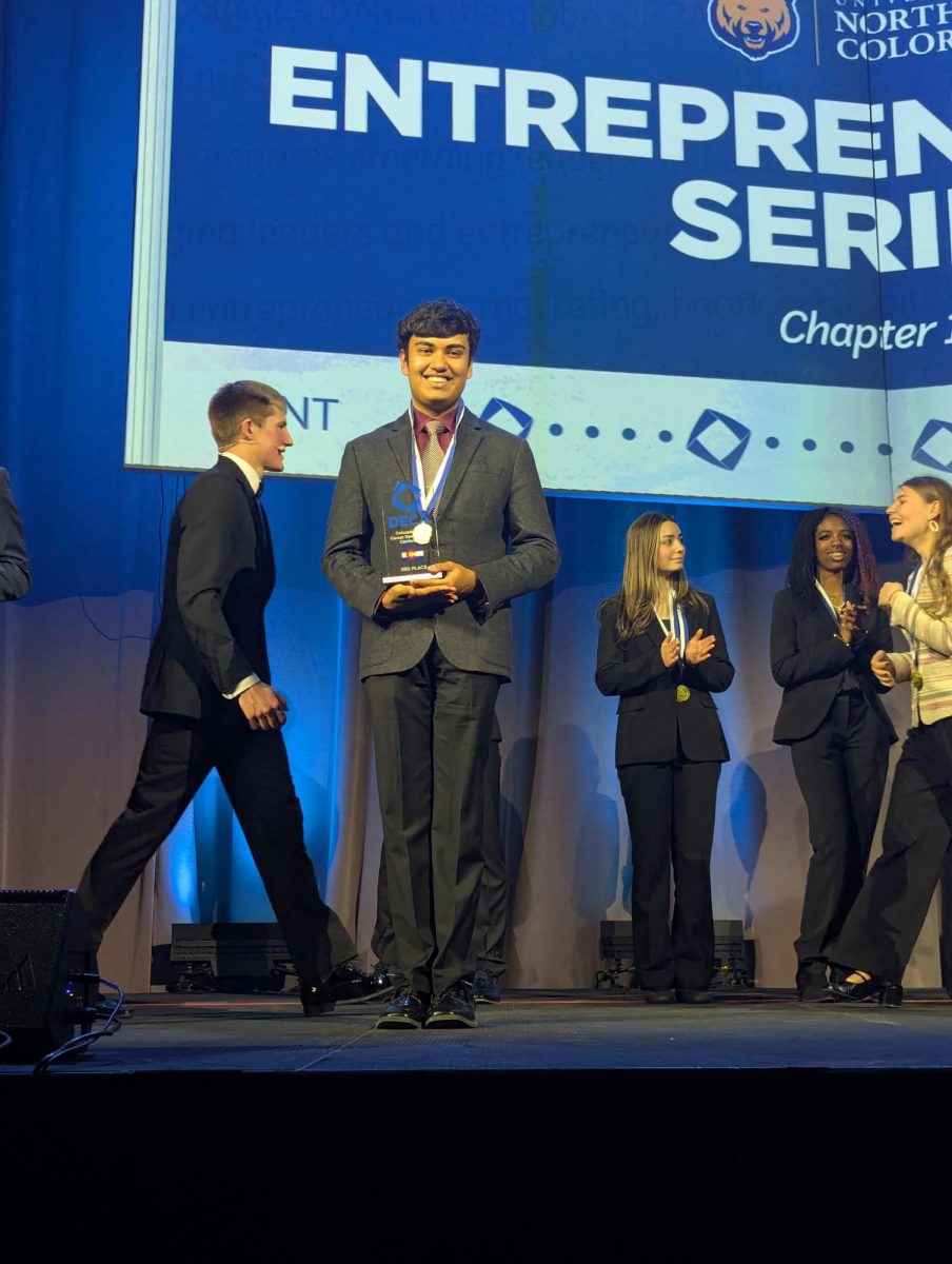 Sachit Srinivas stands on stage accepting his 3rd place finish in his event during the closing ceremony at the Broadmoor on February 24e, 2026.