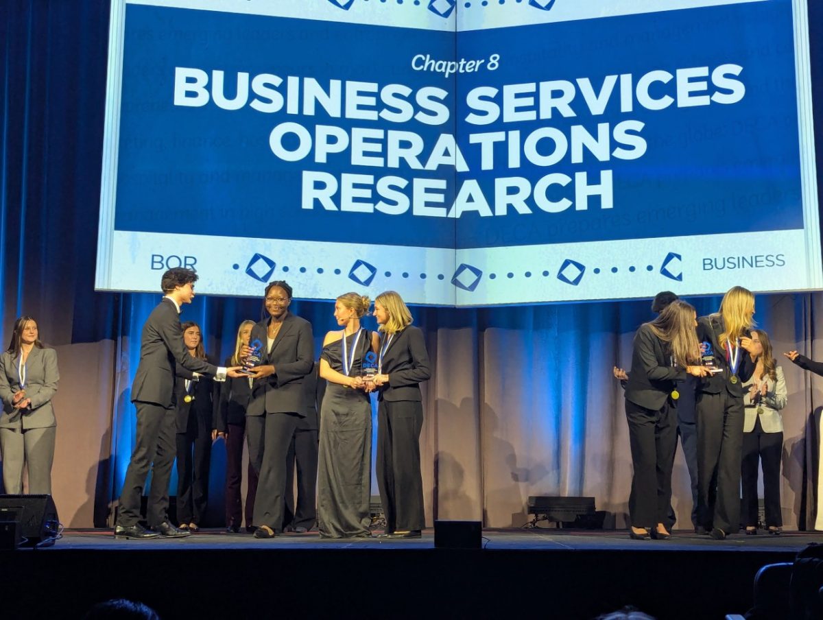 Holly Dossou accepts her 3rd place trophy in her event during the closing ceremony on Febraury 24, 2026 in Colorado Springs.