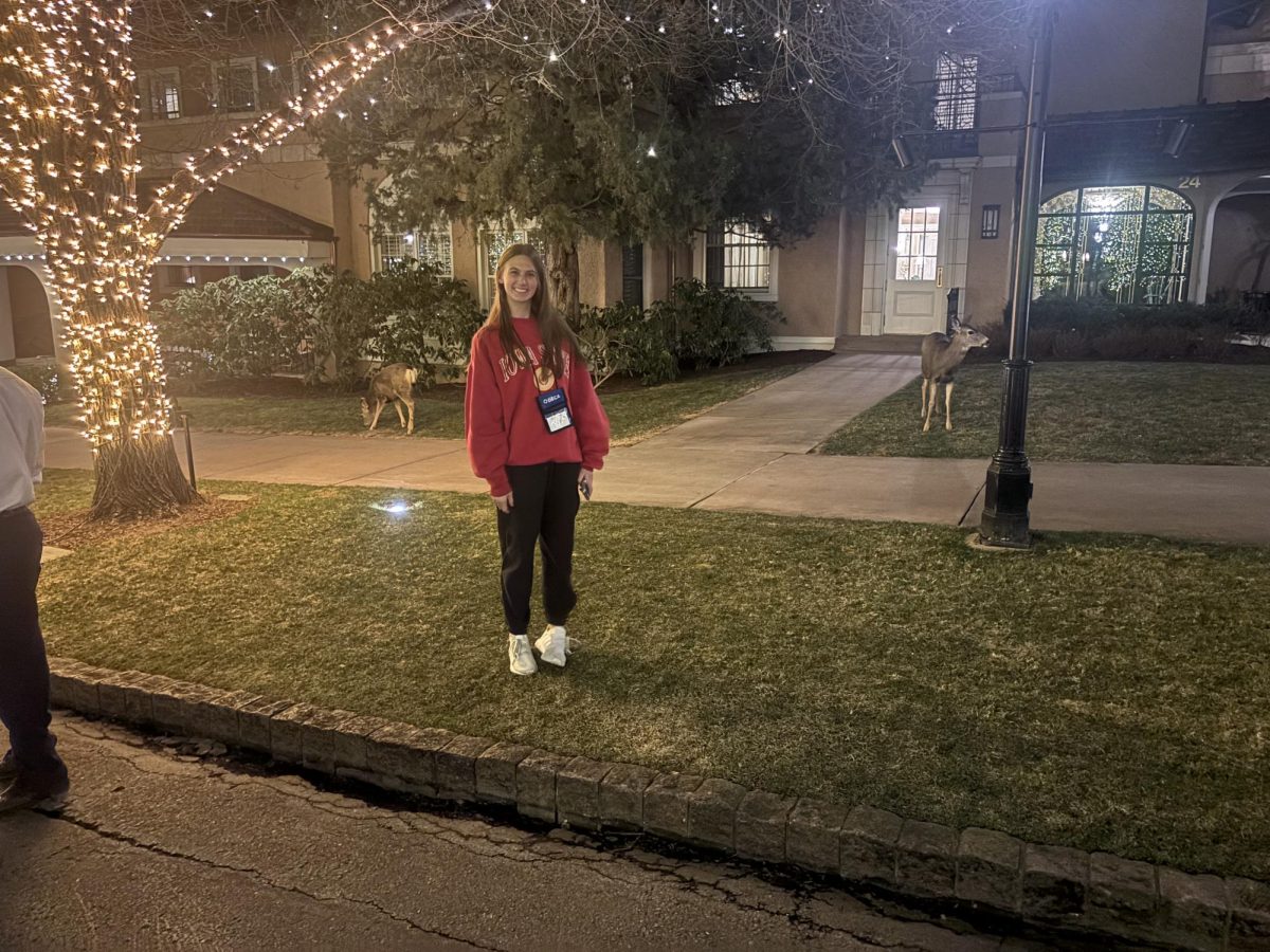Maddie Kubat finds a poses with a deer at the Broadmoor on February 23, 2026.