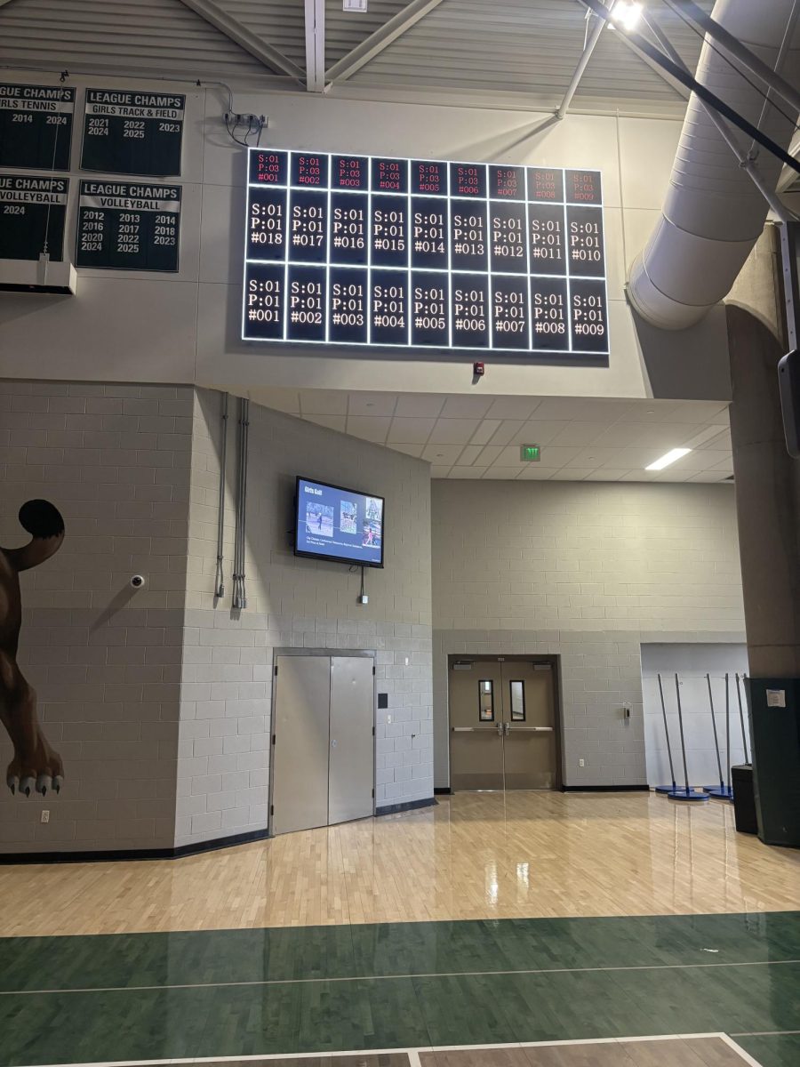 New scoreboard is illuminated in the gym at Fossil Ridge High School on March 31, 2026.