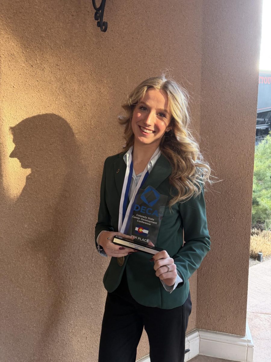 Delaney Schuster poses with her trophy at the Broadmoor after the closing ceremony on February 24,2026 where she finished 7th place in her event. 