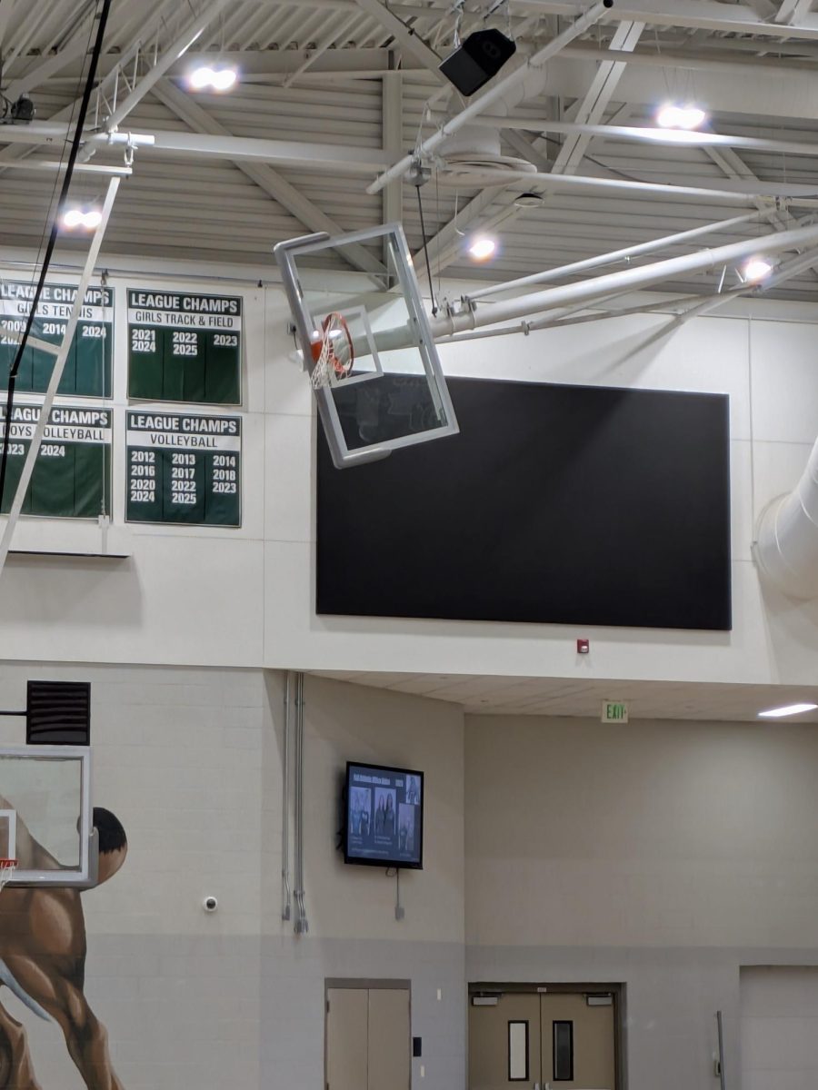 Fully finished scoreboard on east wall of the gym at Fossil Ridge High School on March 24, 2026.