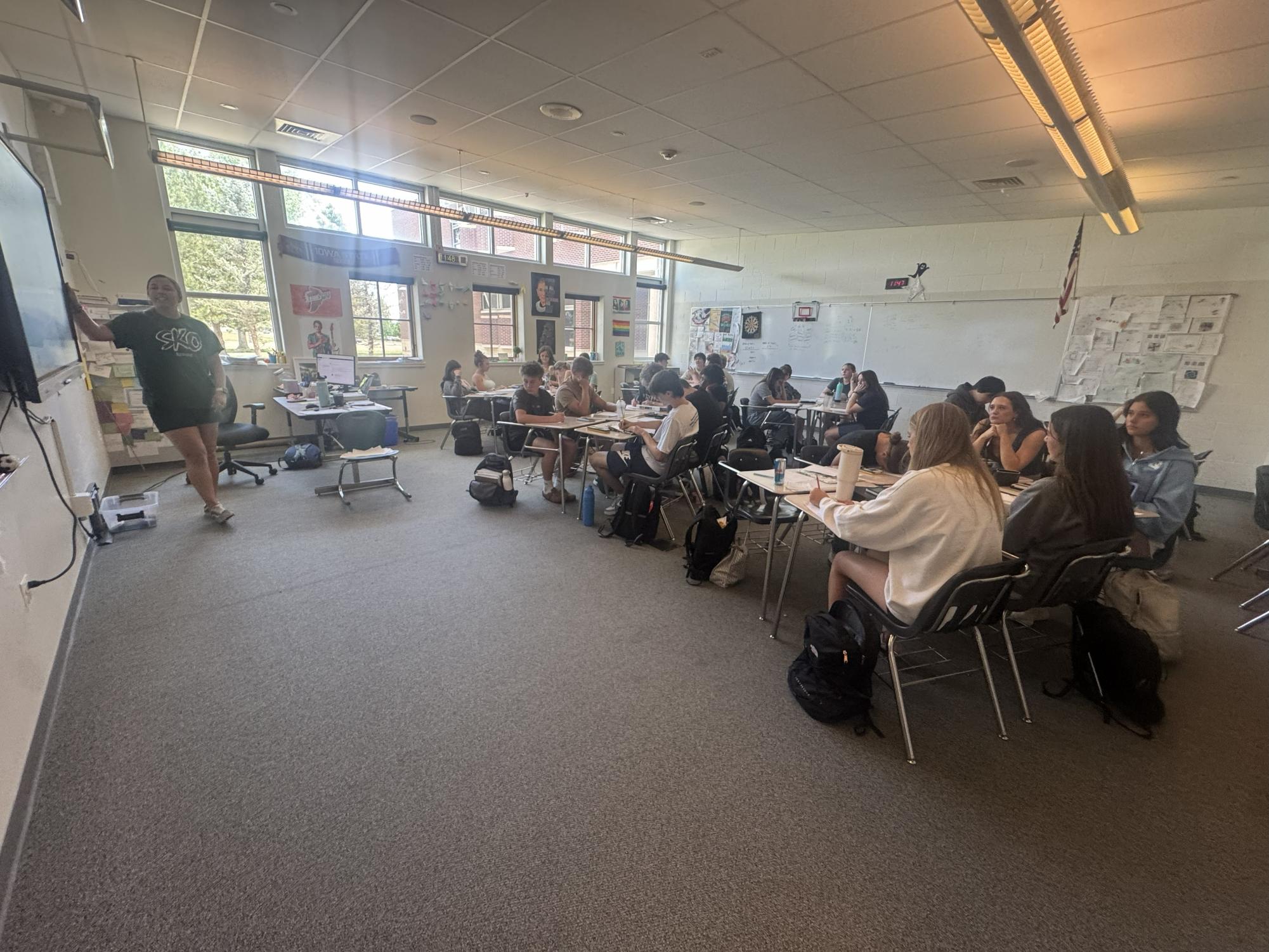 Lauren Roeling in front of her class room teaching Algebra 2. 